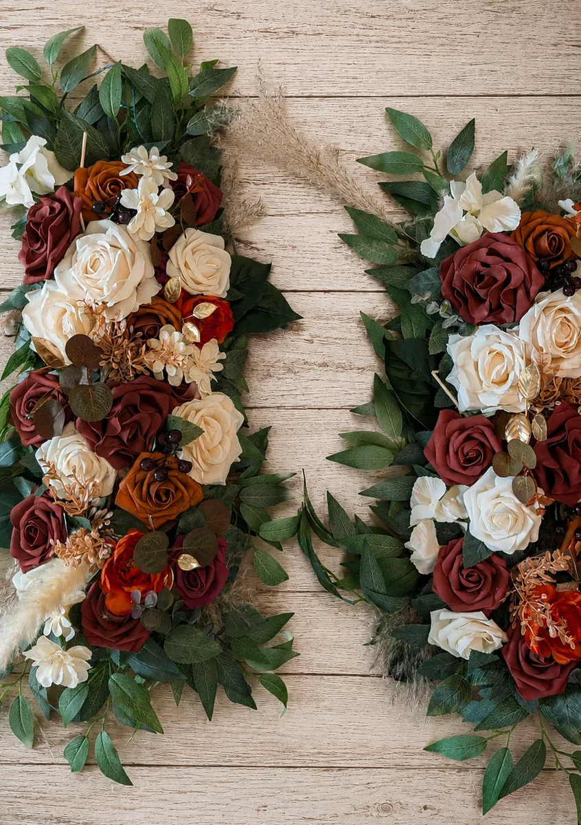 Silk florals and greenery arranged on a wood wedding arch