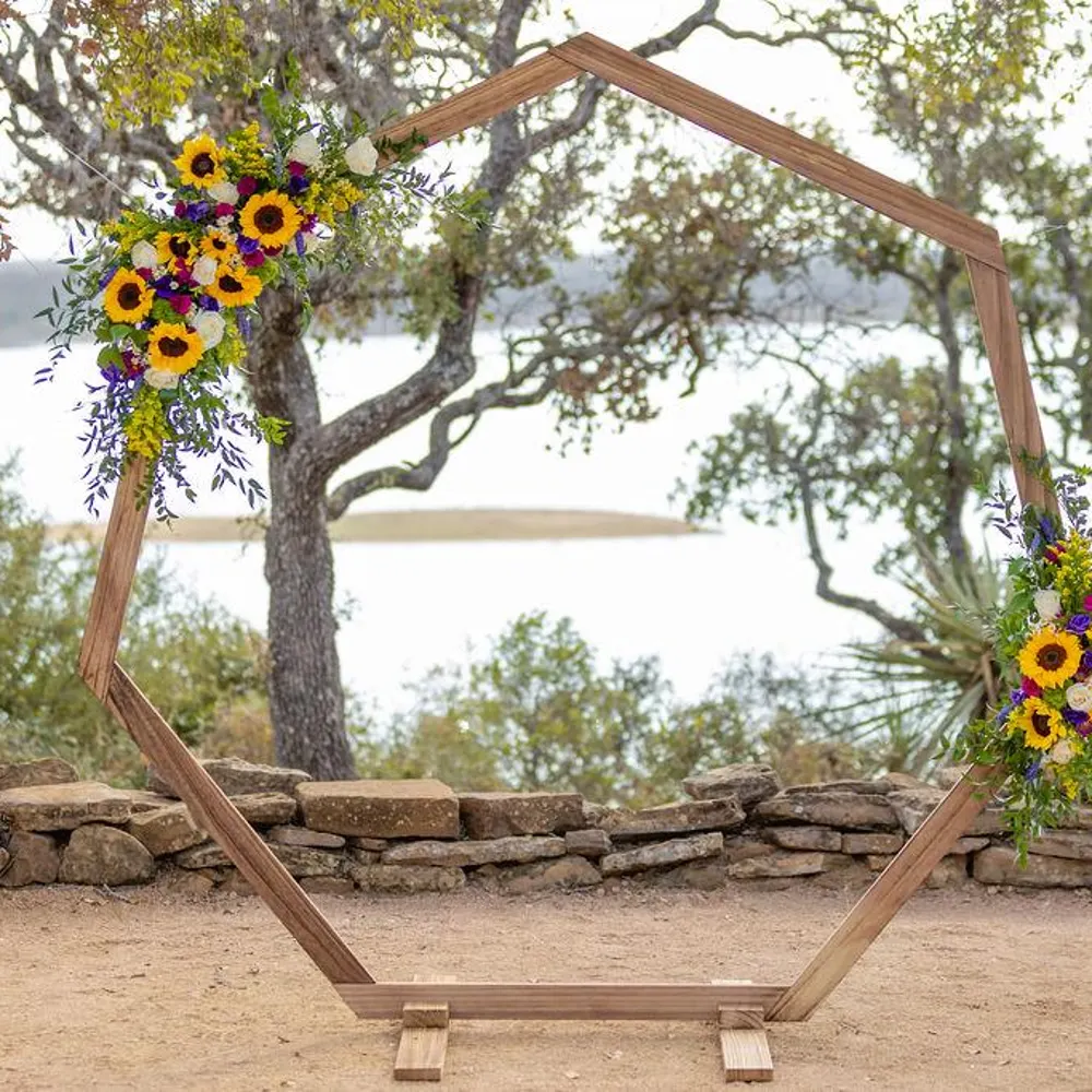 The Timber Hexagon, a geometric paulownia wood wedding arch rental in Denver